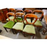 A Harlequin set of seven Victorian mahogany balloon back dining chairs