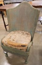 A Lloyd Loom green wicker chair