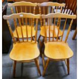 A set of four beech spindle back kitchen chairs