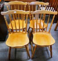 A set of four beech spindle back kitchen chairs