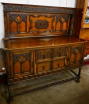 An early 20th Century carved oak barleytwist dresser