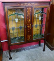 An Art Nouveau inlaid mahogany side cabinet