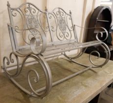 A French style wrought metal rocking garden bench