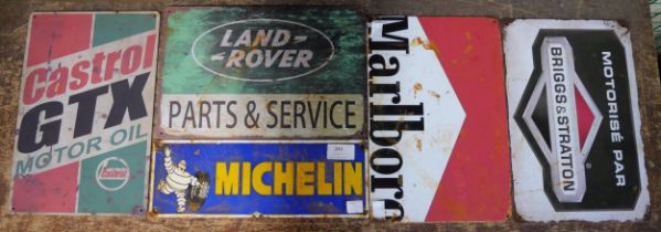 A Michelin enamel sign and four tin advertising signs