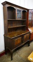 An Arts and Crafts oak dresser