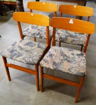 A set of four teak dining chairs