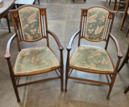 A pair of Art Nouveau inlaid mahogany elbow chairs