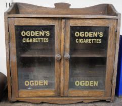 A counter top shop display cabinet, bearing Ogden's Cigarettes inscription