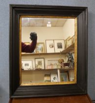 A Victorian style ebonised framed mirror