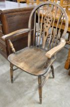 An elm and beech wheelback kitchen elbow chair