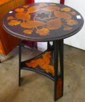 A Liberty & Co. style Arts and Crafts pokerwork beech occasional table