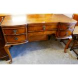 A Queen Anne style figured walnut desk