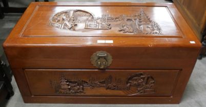 A Chinese carved camphorwood blanket box