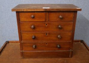 A Victorian miniature mahogany chest of drawers