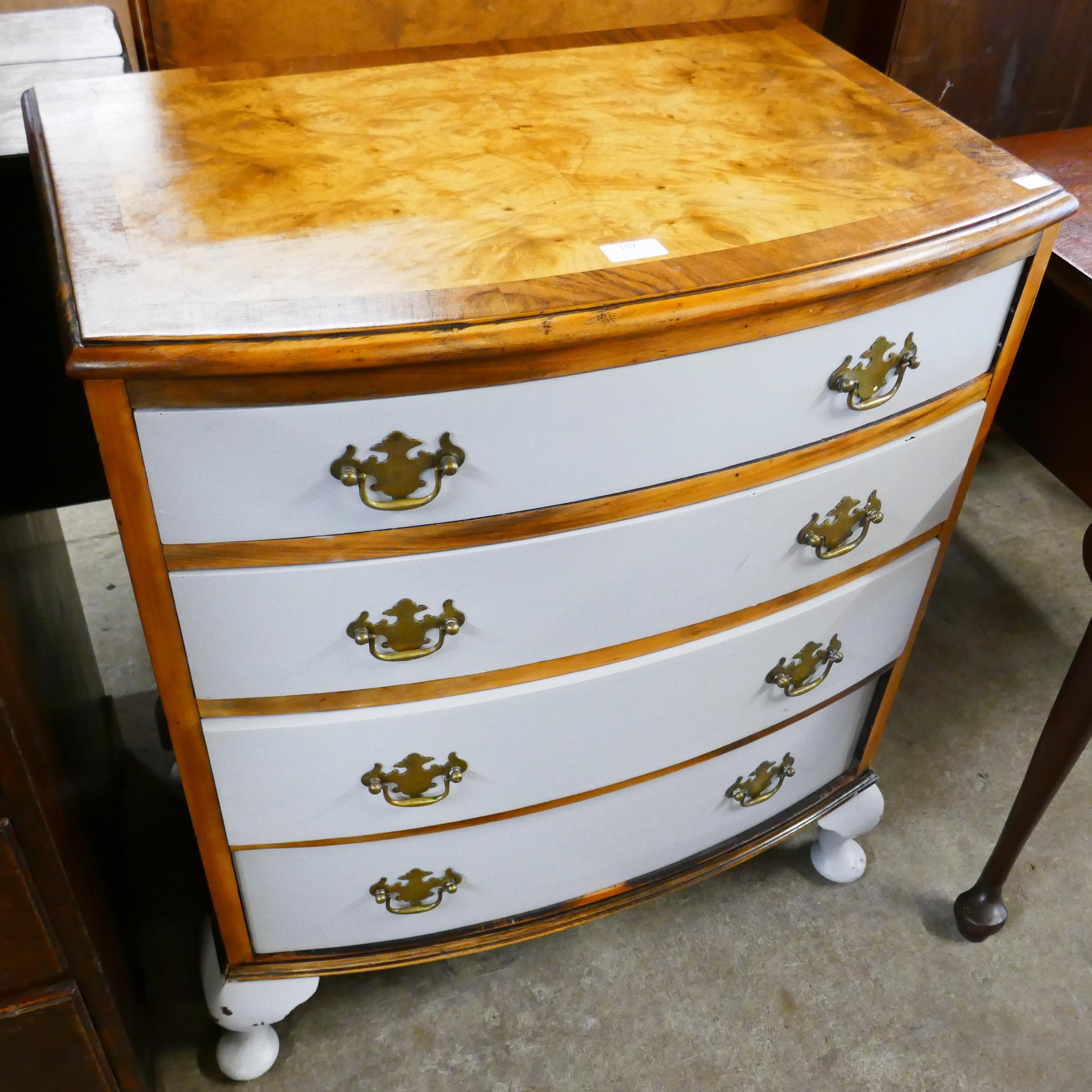 A George III style painted walnut bow front chest of drawers