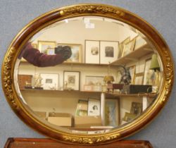 A French style oval gilt framed mirror