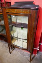 An Edward VII inlaid mahogany bowfront display cabinet