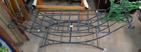 A wrought metal garden seat