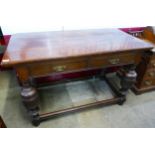 A late Victorian oak two drawer library table