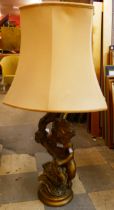 A gilt figural cherub table lamp