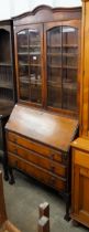 A walnut bureau bookcase