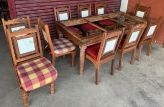 An eastern hardwood and marble topped dining table and chairs