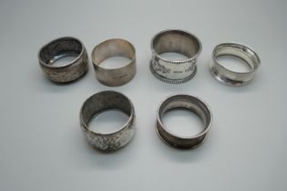 Six silver napkin rings including two Victorian, 104g