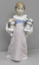 A Lladro figure, 'Arms Full of Love', boxed, signed and dated 1998