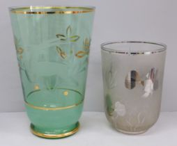 A large 1950s glass vase, etched with flowers and a stylised antelope and a glass vase with