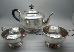 A three piece silver tea service, Birmingham 1958, 627g