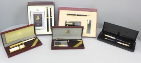 Five pen sets including two with lighters