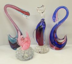 A Murano glass model of a cat, two swans, one a/f and a fish paperweight