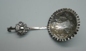 A ladle embossed with storks, London 1902 import mark, 26g, bowl 57mm diameter