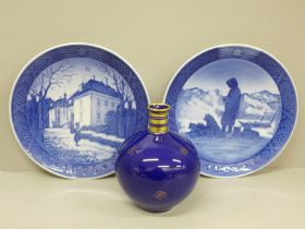 An Aristo Copenhagen blue bottle vase and two Royal Copenhagen Christmas plates