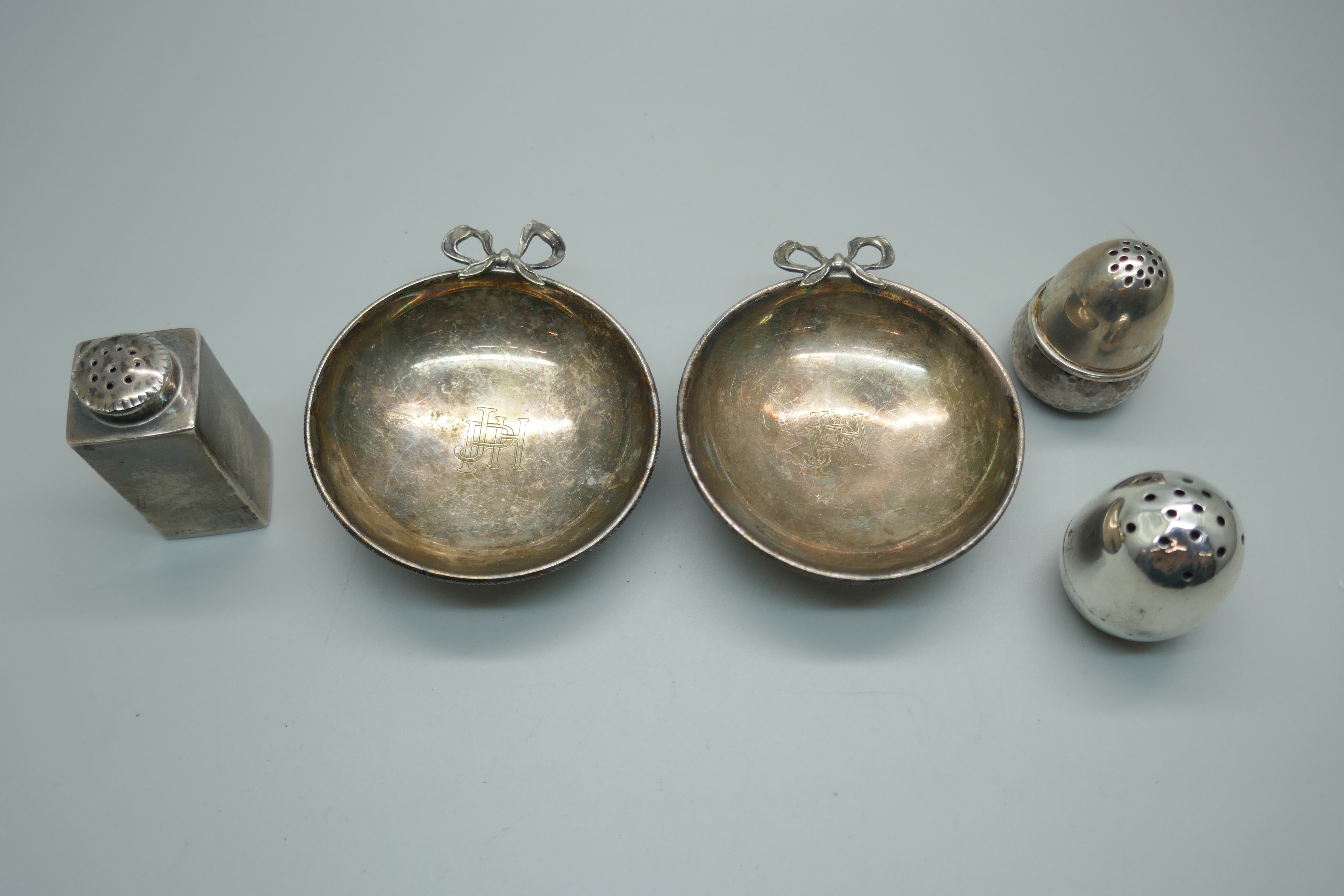 Three silver peppers including one Victorian and one Danish, and a pair of dishes, (peppers 67g)