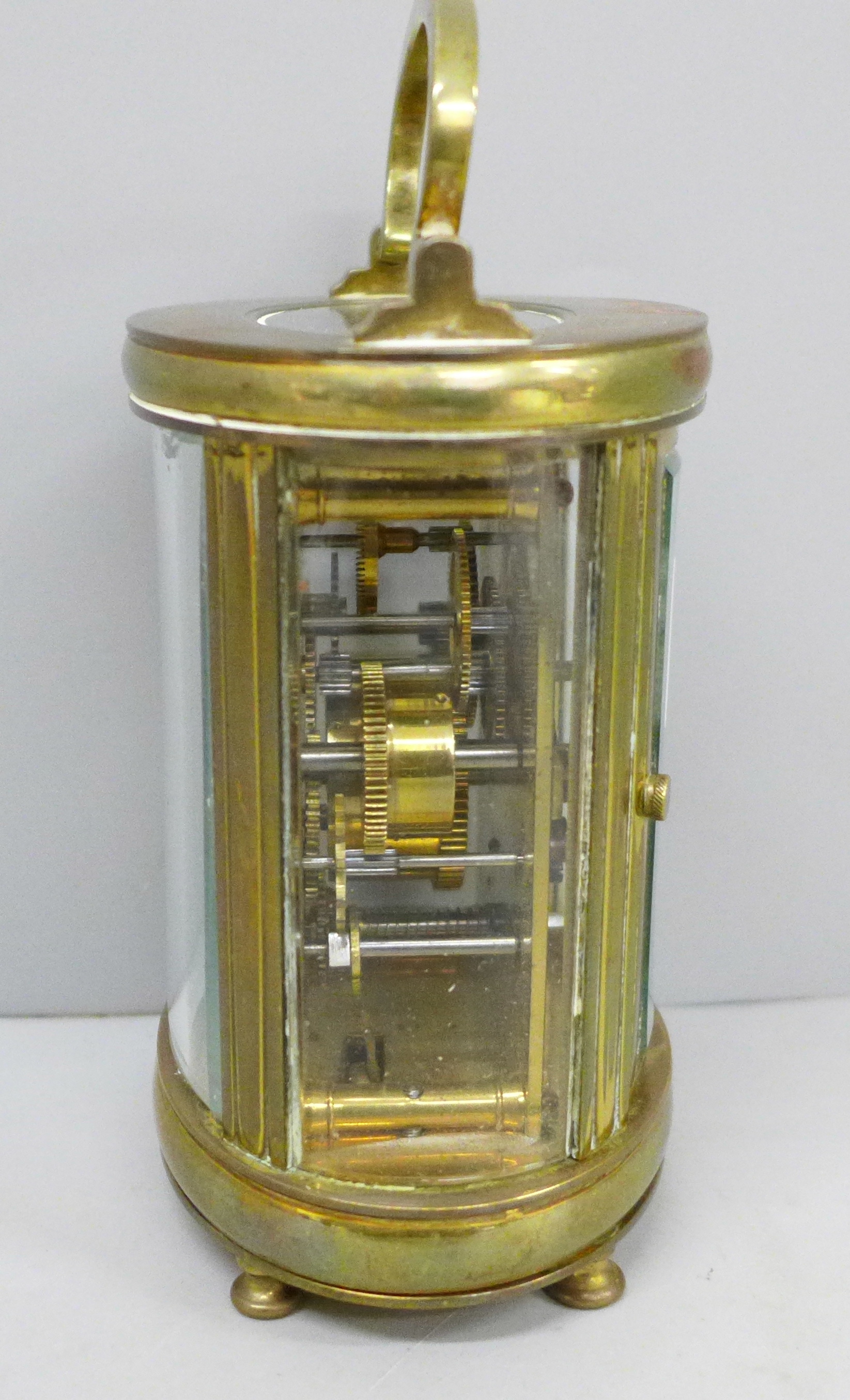 A French 19th Century gilt brass and glass oval cased carriage clock, with alarm - Image 2 of 5