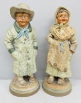 A pair of 19th Century German pottery figures of a boy and girl, 19cm