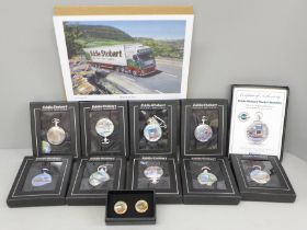 A collection of nine Eddie Stobart pocket watches, a pair of cufflinks and two Eddie Stobart prints
