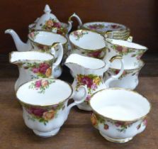 A Royal Albert Old Country Roses tea set, seven cups and saucers, six tea plates, teapot, two creams