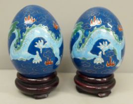A pair of Chinese eggs on stands