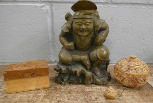 Oriental items including cast pressed stone Chinese figure holding a fish, 23cms, a Chinese wooden
