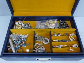 A jewellery box and vintage costume jewellery including some silver (in silver cabinet)