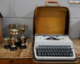 A vintage typewriter and a collection of trophies **PLEASE NOTE THIS LOT IS NOT ELIGIBLE FOR POSTING