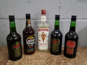 Three bottles of QC, one Captain Morgan and one Beefeater Gin **PLEASE NOTE THIS LOT IS NOT ELIGIBLE