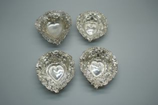 Four pierced silver and embossed dishes, Birmingham 1895/98, 51g, (3+1)