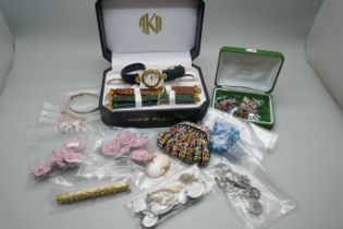 Costume jewellery, etc., including a small silver bangle, a gold tone and stone set pen, charms,