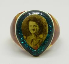 A celluloid prison ring with sweetheart photograph and with blue/green glitter border, size V