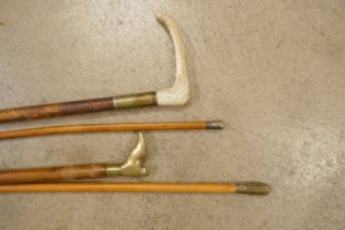 Two riding crops and two swagger sticks