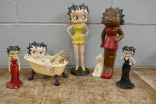 Six Betty Boop resin figures including one in lemon yellow glitter dress, one in bathtub, one seated