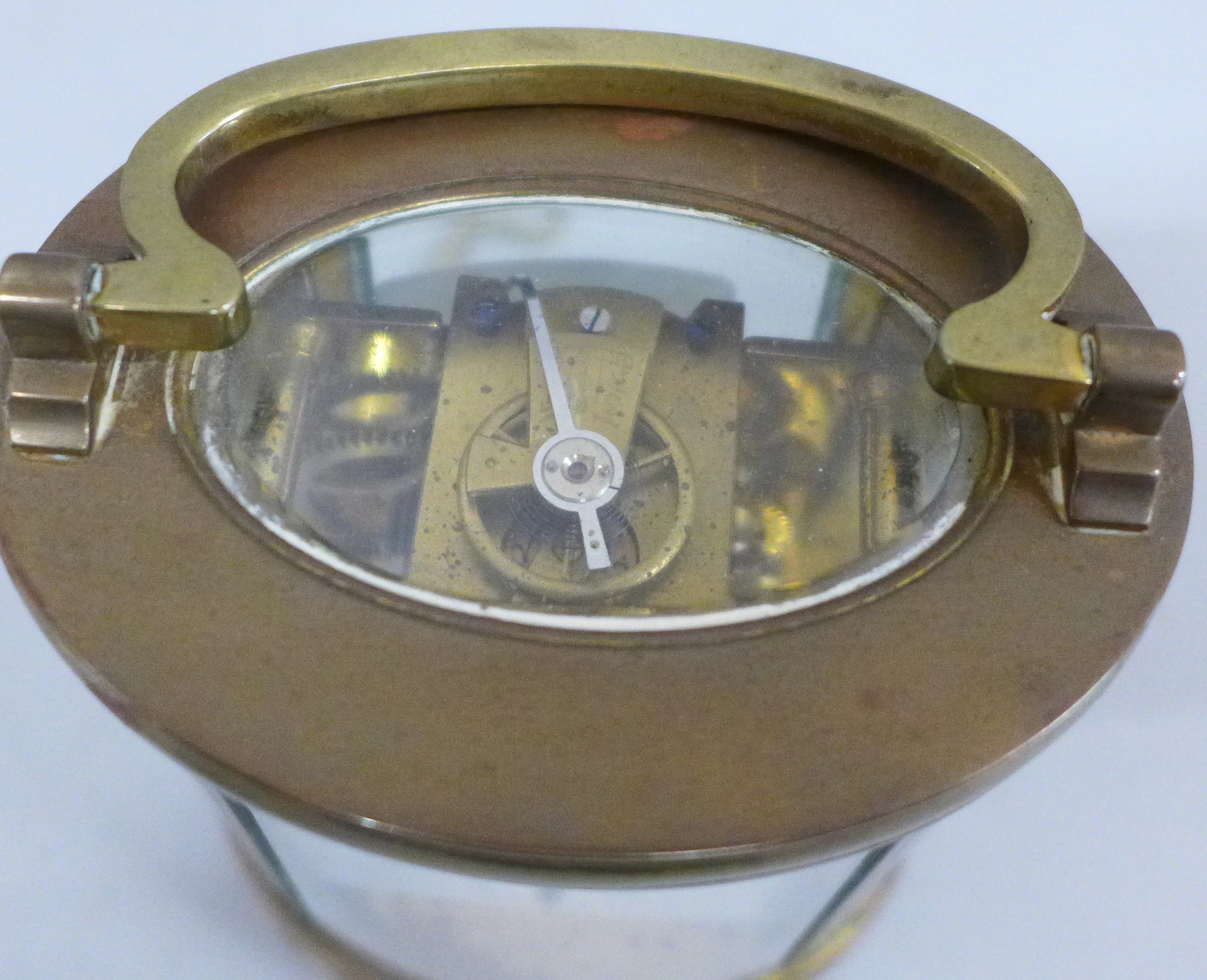 A French 19th Century gilt brass and glass oval cased carriage clock, with alarm - Image 5 of 5